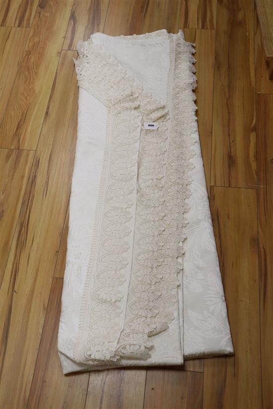A lace trimmed oyster satin bedspread